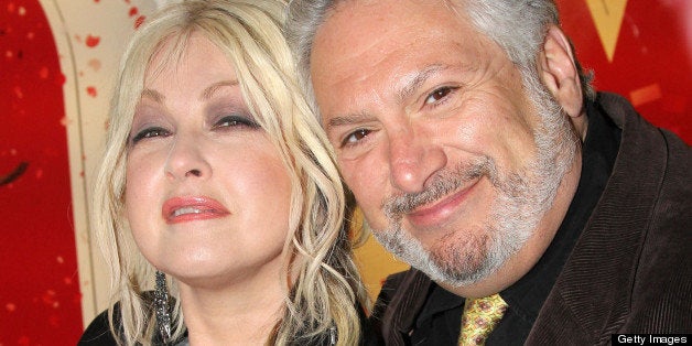 NEW YORK, NY - APRIL 02: Cyndi Lauper and Harvey Fierstein pose inside the NYC Subway where Broadway's 'Kinky Boots' Everybody Say Yeah Ad is being unveiled in Times Square Subway Station on April 2, 2013 in New York City. (Photo by Bruce Glikas/FilmMagic)