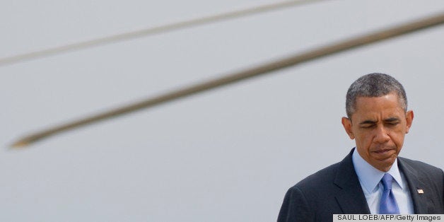 US President Barack Obama walks to Air Force One prior to departure from Andrews Air Force Base in Maryland on May 28, 2013. Obama is traveling to the New Jersey shore to view rebuilding efforts following last year's Hurricane Sandy. AFP PHOTO / Saul LOEB (Photo credit should read SAUL LOEB/AFP/Getty Images)