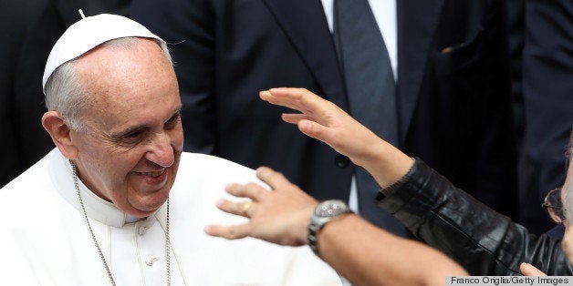 ROME, ITALY - MAY 26: Pope Francis greets the faithful as he leaves the Roman parish of Saint Elisabeth and Zechariah on May 26, 2013 in Rome, Italy. Pope Francis made his first Pastoral visit to a parish as Bishop of Rome early on Sunday for the feast of the Holy Trinity. (Photo by Franco Origlia/Getty Images)