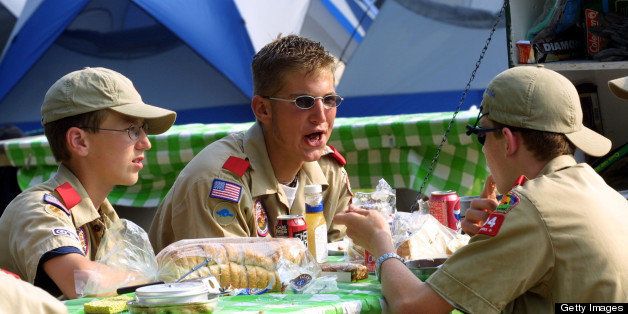 392677 10: Boy Scouts from Troop 1004 eat supper July 31, 2001 during the 15th National Scout Jamboree at Fort A.P. Hill, Va. (Photo by Alex Wong/Getty Images)