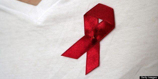 GERMANY - MAY 24: AIDS ribbon on shirt. (Photo by Ulrich Baumgarten via Getty Images)