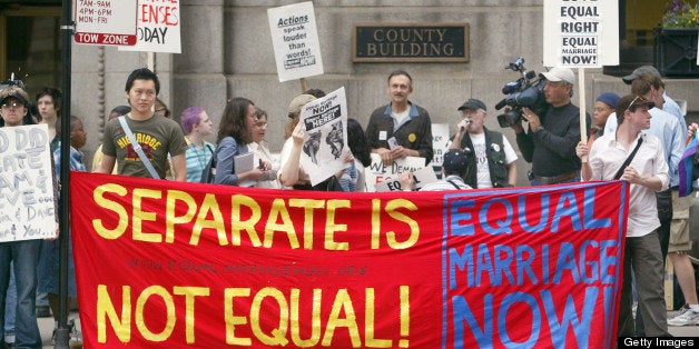 CHICAGO - MAY 17: Demonstrators rally outside City Hall May 17, 2004 in Chicago, Illinois. Supporters and non-supporters of equal marriage rights gathered outside the Cook County (Illinois) Marriage License Bureau located in Chicago's City Hall in reaction to the state of Massachusetts legalizing the practice of same-sex marriages. (Photo by Tim Boyle/Getty Images)