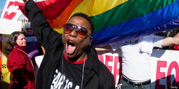 UNITED STATES - MARCH 27: Cd Kirven, of Dallas, Texas, leads chants for marriage equality supporters as they rally in front of the Supreme Court before oral arguments in the United States v. Windsor case, which will test the constitutionality of the Defense of Marriage Act on March 27, 2013. The Defense of Marriage Act, or DOMA, is a 1996 federal statute defining marriage as the union of one man and one woman. (Photo By Bill Clark/CQ Roll Call)