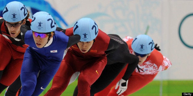 Canada's Olivier Jean (L), New Zealand's Blake Skjellerup (2nd L), Xianwei Liu of China and Russia's Ruslan Zakharov compete in a men's 1,500m short-track qualifying heat at the Pacific Coliseum in Vancouver during the 2010 Winter Olympics on February 13, 2010. AFP PHOTO/Dimitar DILKOFF (Photo credit should read DIMITAR DILKOFF/AFP/Getty Images)