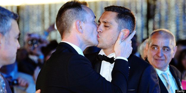 Vincent Autin (L) and Bruno Boileau kiss during their marriage, France's first official gay marriage, at the city hall in Montpellier on May 29, 2013. France is the 14th country to legalise same-sex marriage, an issue that has also divided opinion in many other nations. The definitive vote in the French parliament came on April 23 when the law was passed legalising both homosexual marriages and adoptions by gay couples. AFP PHOTO / GERARD JULIEN (Photo credit should read GERARD JULIEN/AFP/Getty Images)