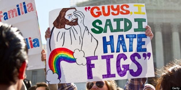 [UNVERIFIED CONTENT] Supporter of gay marriage holds signs during the DOMA and Prop 8 hearing at the Supreme Court in March 2013.