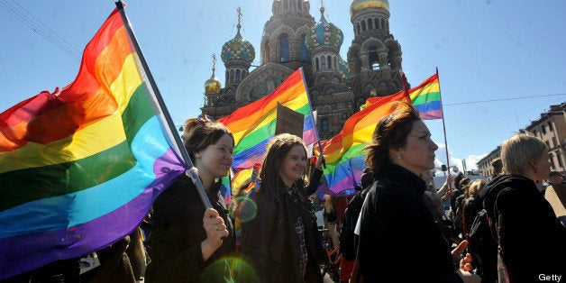 Gay rights activists march in Russia's second city of St. Petersburg May 1, 2013, during their rally against a controversial law in the city that activists see as violating the rights of gays. AFP PHOTO / OLGA MALTSEVA (Photo credit should read OLGA MALTSEVA/AFP/Getty Images)