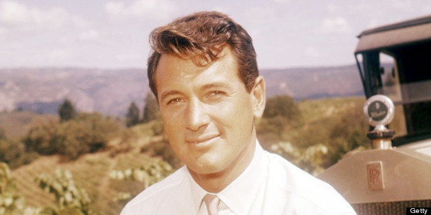 American actor Rock Hudson (1925 - 1985) standing next to a vintage Rolls-Royce car, circa 1960. (Photo by Silver Screen Collection/Getty Images)