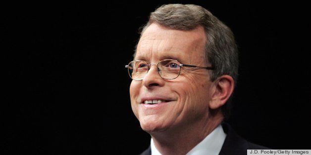 TOLEDO, OH - OCTOBER 19: U.S. Sen. Mike DeWine (R - Ohio) smiles while looking at a T.V. camera before facing off October 19, 2006, against challenger U.S. Rep. Sherrod Brown (D - Ohio) before a live Televised debate at the Stranahan Theater in Toledo, Ohio. (Photo by J.D. Pooley/Getty Images)