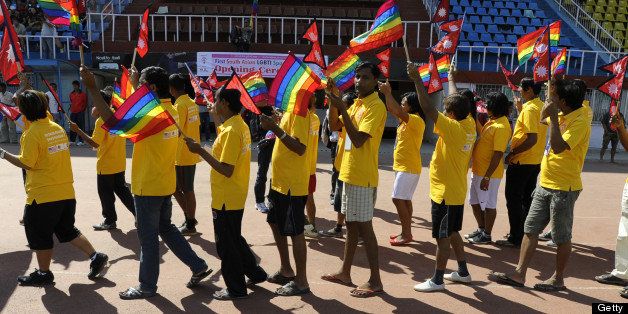 Participants hold Nepalese and rainbow flags during the opening ceremony of the first South Asia Lesbian, Gay, Bisexual and Transgender (LGBT) Sports Festival in Kathmandu on October 12, 2012. Hundreds of athletes Friday took part in Asia's first-ever sports tournament for lesbians, gays, bisexuals and transgenders in the Nepalese capital Kathmandu, organisers said. AFP PHOTO/Prakash MATHEMA (Photo credit should read PRAKASH MATHEMA/AFP/GettyImages)