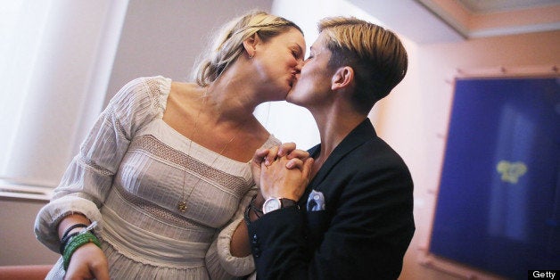 NEW YORK, NY - JUNE 28: Stefanie Berks (L) and Daisy Boyd kiss after their marriage ceremony in the east chapel at the Manha
