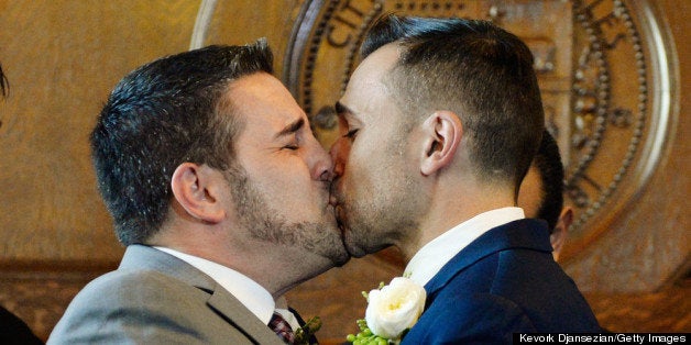 LOS ANGELES, CA - JUNE 28: Same-sex couple Jeff Zarillo (L) and Paul Katami kiss after they were married at Los Angeles City