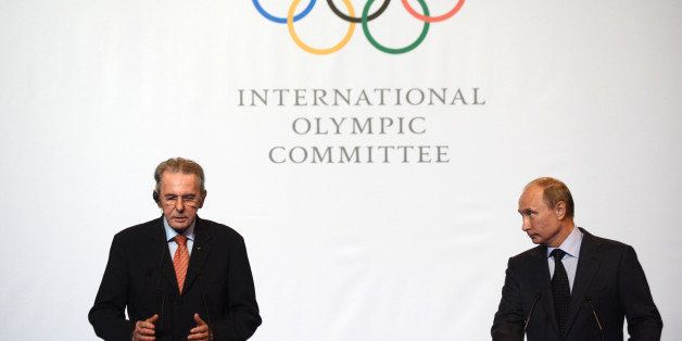 Russia's President Vladimir Putin (R) and IOC President Jacques Rogge attend an IOC executive board meeting at the SportAccord International Convention in St. Petersburg, on May 30, 2013. AFP PHOTO / POOL/ KIRILL KUDRYAVTSEV (Photo credit should read KIRILL KUDRYAVTSEV/AFP/Getty Images)