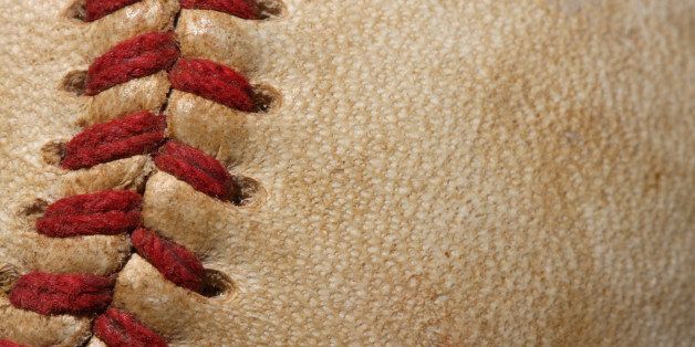 close up of a baseball threads...