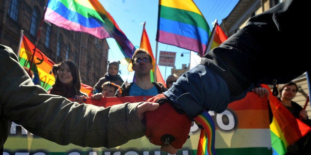 Gay rights activists march in Russia's second city of St. Petersburg May 1, 2013, during their rally against a controversial law in the city that activists see as violating the rights of gays. AFP PHOTO / OLGA MALTSEVA (Photo credit should read OLGA MALTSEVA/AFP/Getty Images)