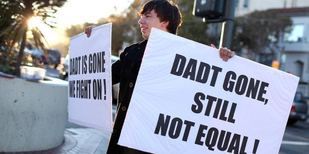 SAN FRANCISCO, CA - SEPTEMBER 20: A protestor holds signs as he celebrates the end of 'Don't Ask, Don't Tell' but demands equal rights for gays and lesbians on September 20, 2011 in San Francisco, California. The end of the 18 year-old law 'Don't Ask Don't Tell' took effect today now allowing gays to openly serve in the armed forces. (Photo by Justin Sullivan/Getty Images)