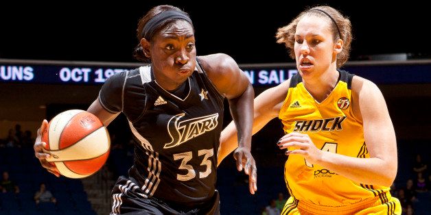 TULSA, OK - September 12: Sophia Young #22 of the San Antonio Silver Stars drives past Kayla Peterson #14 of the Tulsa Shock during the WNBA game on September 12, 2012 at the BOK Center in Tulsa, Oklahoma. NOTE TO USER: User expressly acknowledges and agrees that, by downloading and or using this photograph, User is consenting to the terms and conditions of the Getty Images License Agreement. Mandatory Copyright Notice: Copyright 2012 NBAE (Photo by Shane Bevel/NBAE via Getty Images) 
