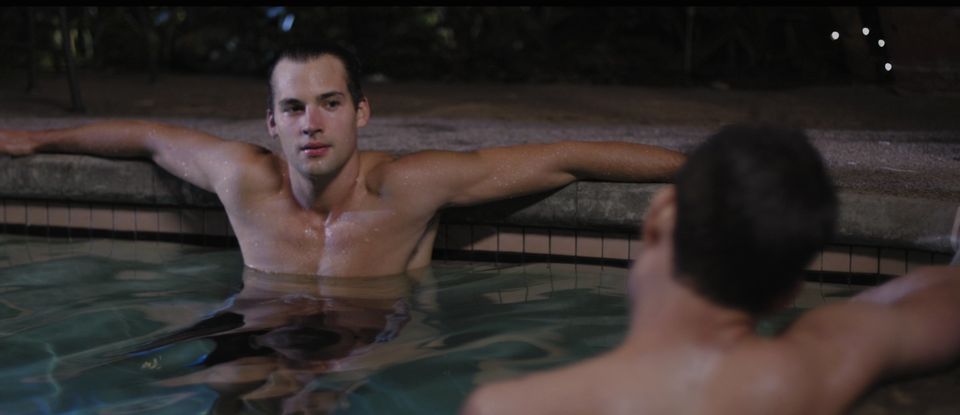 Elliot (Vigilant) is seduced by Ted (Weaver) in the film's steamy hot tub scene. 