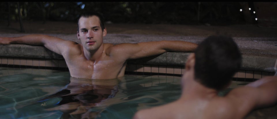 Elliot (Vigilant) is seduced by Ted (Weaver) in the film's steamy hot tub scene. 