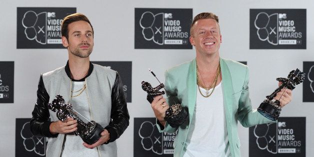 NEW YORK, NY - AUGUST 25: Ryan Lewis (L) and Macklemore pose with Best Hip Hop Video, Best Video With A Social Message and Best Cinematography awards in the press room at the 2013 MTV Video Music Awards at the Barclays Center on August 25, 2013 in the Brooklyn borough of New York City. (Photo by Dimitrios Kambouris/WireImage)