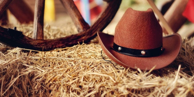 on a haystack the brown cowboy...
