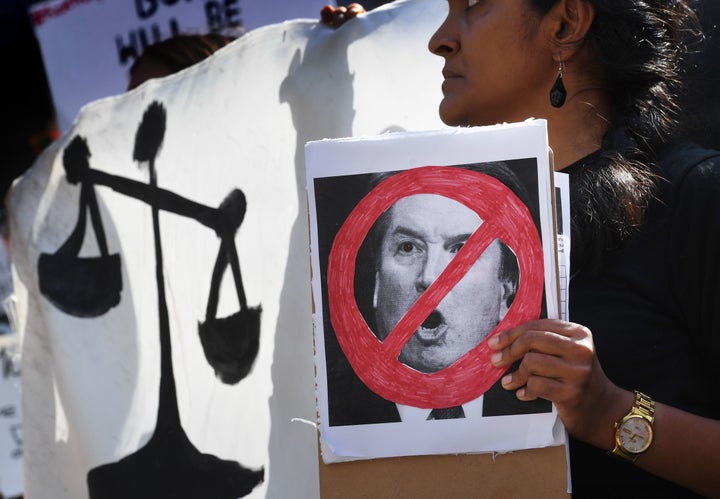 Demonstrators in Los Angeles hold anti-Kavanaugh signs and banners on Sept. 28, one day after Christine Blasey Ford testified before the Senate Judiciary Committee concerning Supreme Court nominee Brett Kavanaugh. The ACLU says her testimony was credible. 