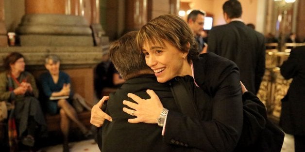 Chicago Ald. Deb Mell, 33rd Ward, is hugged after the gay marriage bill cleared the House on Tuesday, November 5, 2013, in Sp