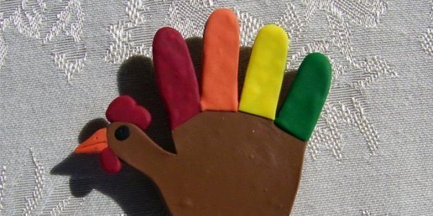 This is a polymer clay magnet is shaped like the construction paper "hand" turkey's we all once made in kindergarten. :) This piece is simple and designed to look like it was made by a child. The body (palm) of the turkey (hand) is brown and the feathers (fingers) are red, orange, yellow, and green. Its head (thumb) is finished with an orange beak and red comb. This turkey is just over 2-1/2" tall and 2-1/2" wide.