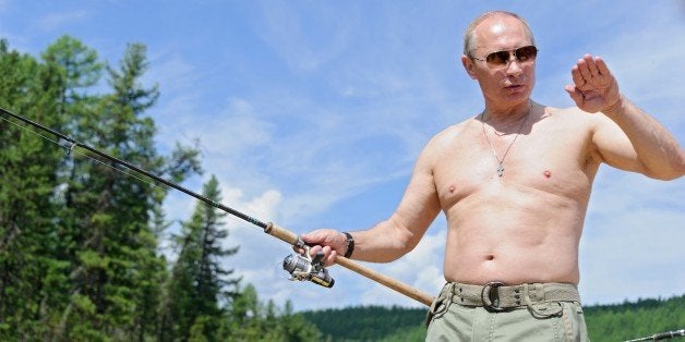 This picture made available on July 26, 2013 shows Russian President Vladimir Putin fishing in the Tyva region on July 20, 20