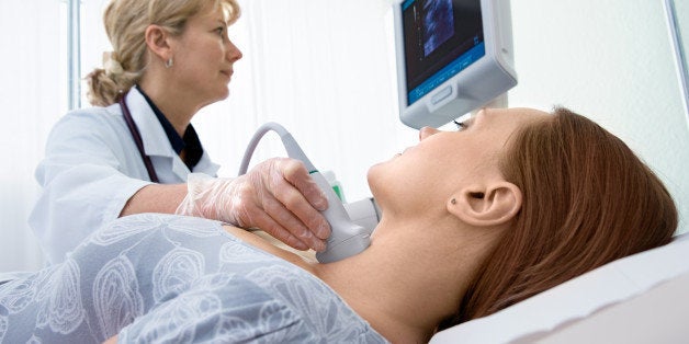 woman getting ultrasound of a...