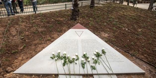 Flowers are laid at a memorial to thousands of gay Holocaust victims killed by the Nazi during the Second War at the Gan Meir