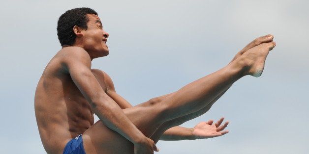 Brazilian Matos Ian (bronze medal) competes in the diving men's 3m springboard during the final IX South American Games in Medellin, Antioquia department, Colombia on March 20, 2010. AFP PHOTO/Raul ARBOLEDA (Photo credit should read RAUL ARBOLEDA/AFP/Getty Images)