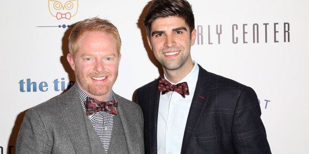 LOS ANGELES, CA - DECEMBER 05: Actor Jesse Tyler Ferguson (L) and husband Justin Mikita attend Tie The Knot Pop-Up Store at The Beverly Center on December 5, 2013 in Los Angeles, California. (Photo by Brian To/WireImage)