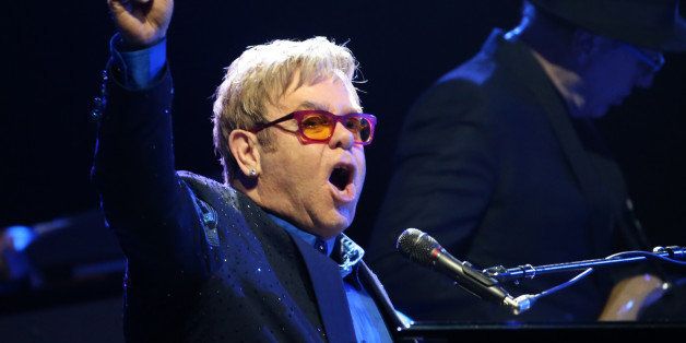 British singer Elton John performs during a concert at the Olympia concert hall in Paris on December 10, 2013. AFP PHOTO / KENZO TRIBOUILLARD (Photo credit should read KENZO TRIBOUILLARD/AFP/Getty Images)