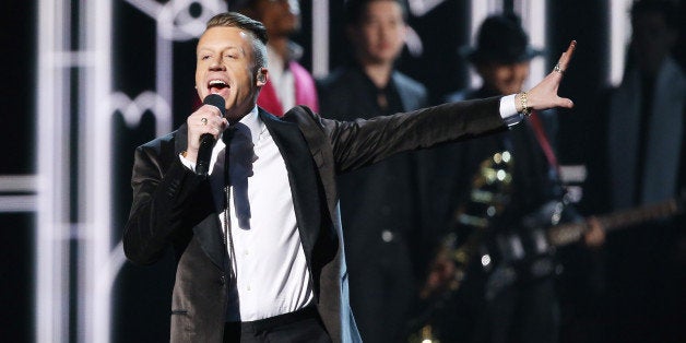 LOS ANGELES, CA - JANUARY 26: Macklemore aka Ben Haggerty performs onstage during the 56th GRAMMY Awards held at Staples Center on January 26, 2014 in Los Angeles, California. (Photo by Michael Tran/FilmMagic)