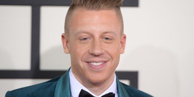 Nominee For Best Rap Album 'The Heist' Macklemore arrives on the red carpet during the 56th Grammy Awards at the Staples Center in Los Angeles, California, January 26, 2014. AFP PHOTO ROBYN BECK (Photo credit should read ROBYN BECK/AFP/Getty Images)