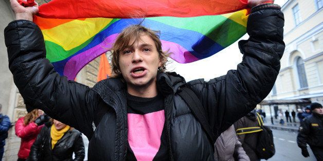 A gay rights activists takes part in a joint opposition rally called 'March against Hatred' in the Russia's second city of St. Petersburg, on November 2, 2013. AFP PHOTO / OLGA MALTSEVA (Photo credit should read OLGA MALTSEVA/AFP/Getty Images)