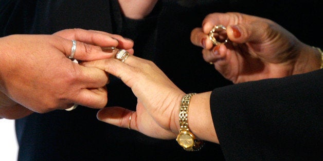 WASHINGTON - MARCH 09: Darlene Garner (L) and Candy Holmes (R), both are reverends of Metropolitan Community Churches, exchange rings during their wedding on the first day same-sex couples are legal to wed under a new law March 9, 2010 in Washington, DC. The District of Columbia has become the sixth place in the nation to recognize same-sex marriage. (Photo by Alex Wong/Getty Images)