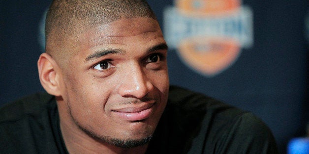 FILE - In this Jan. 1, 2014, file photo, Missouri senior defensive lineman Michael Sam speaks to the media during an NCAA col