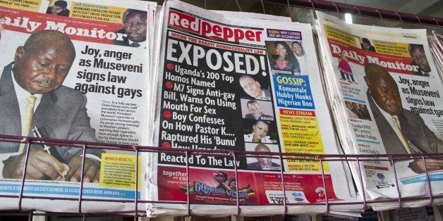 A picture taken on February 25, 2014 shows a newspaper stand with different types of Uganda's local dailies. On Monday, President Yoweri Museveni signed a bill into law which holds that repeat homosexuals should be jailed for life, outlaws the promotion of homosexuality and requires people to denounce gays. AFP PHOTO/ ISAAC KASAMANI (Photo credit should read ISAAC KASAMANI/AFP/Getty Images)