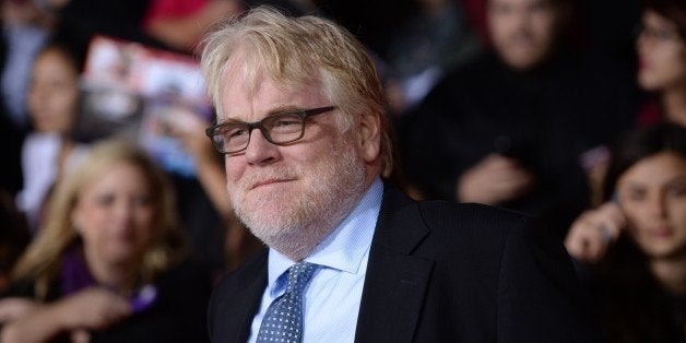 Philip Seymour Hoffman arrives for the Los Angeles premiere of 'The Hunger Games: Catching Fire' at the Nokia Theatre LA Live in Los Angeles, California, November 18, 2013. AFP PHOTO / Robyn Beck (Photo credit should read ROBYN BECK/AFP/Getty Images)