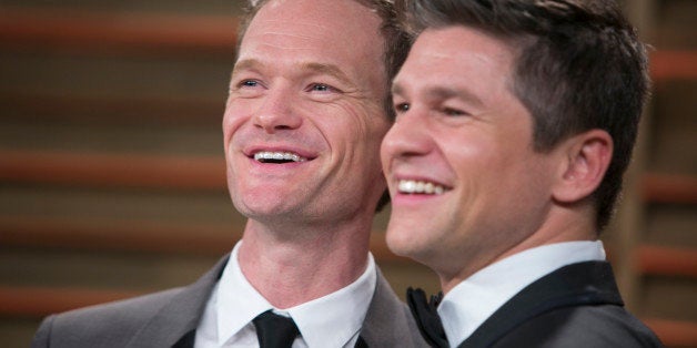 Neil Patrick Harris (L) and his spouse David Burtka arrive at the 2014 Vanity Fair Oscar Party on March 2, 2014 in West Holly