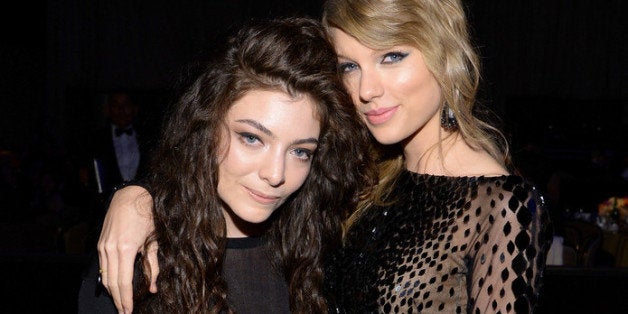 BEVERLY HILLS, CA - JANUARY 25: Recording artists Lorde (L) and Taylor Swift attend the 56th annual GRAMMY Awards Pre-GRAMM