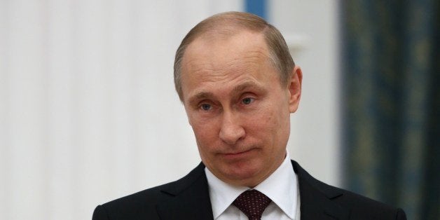 Russia's President Vladimir Putin speaks during a ceremony to sign a law on ratification of a treaty making Crimea part of