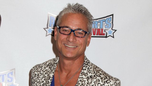NORTH HOLLYWOOD, CA - NOVEMBER 11: Olympic athlete Greg Louganis arrives at the All Sports Film Festival closing ceremony honoring Bruce Jenner at El Portal Theatre on November 11, 2013 in North Hollywood, California. (Photo by Paul Redmond/Getty Images)