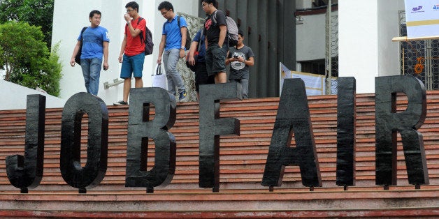 Job seekers attend a job fair at the College of Engineering at the University of the Philippines in Manila on January 16, 201