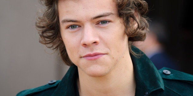 Harry Styles arrives for the Burberry Prorsum Womenswear collection during London Fashion Week Autumn / Winter 2014 in centra