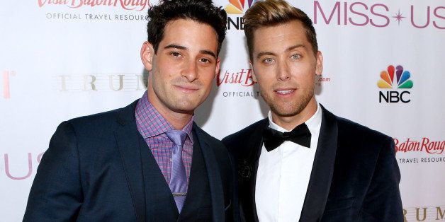 Lance Bass, right, and Michael Turchin pose during a red carpet event before the Miss USA 2014 pageant in Baton Rouge, La., Sunday, June 8, 2014. (AP Photo/Jonathan Bachman)