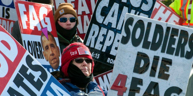 WASHINGTON, DC - JANUARY 21:Isaac Hockenbarger, back and Margie Phelps with the Westboro Baptist Church in Kansas want to bring attention to gay marriage along the Inaugural Parade route near John Marshall Park Monday, January 21, 2013 in Washington, DC.(Photo by Katherine Frey/The Washington Post via Getty Images)