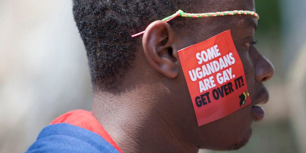 A Ugandan man is seen during the 3rd Annual Lesbian, Gay, Bisexual and Transgender (LGBT) Pride celebrations in Entebbe, Uganda, Saturday, Aug. 9, 2014. Scores of Ugandan homosexuals and their supporters are holding a gay pride parade on a beach in the lakeside town of Entebbe. The parade is their first public event since a Ugandan court invalidated an anti-gay law that was widely condemned by some Western governments and rights watchdogs. (AP Photo/Rebecca Vassie)